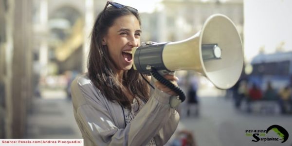 woman screaming into megaphone